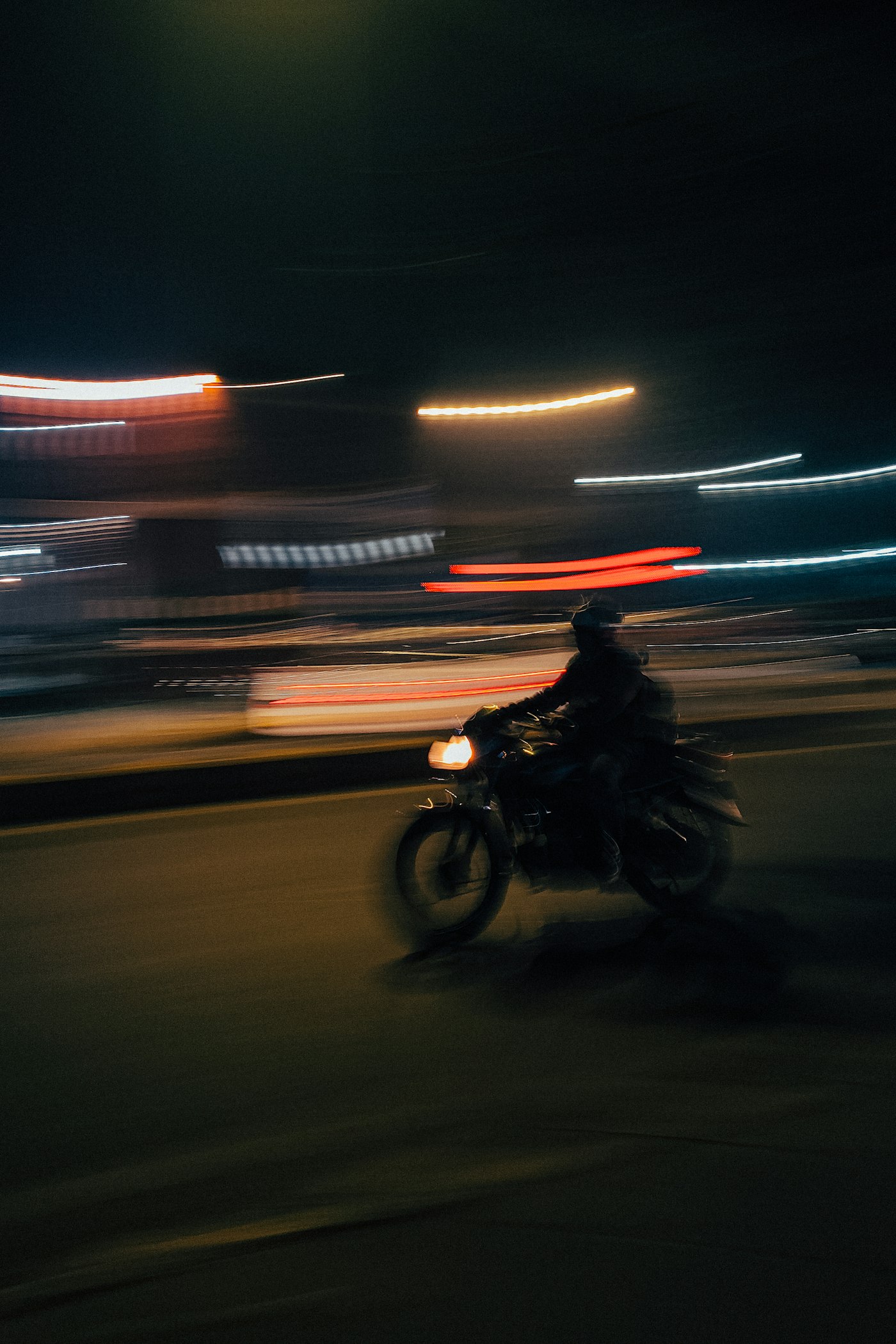 Motorcycle in motion at night